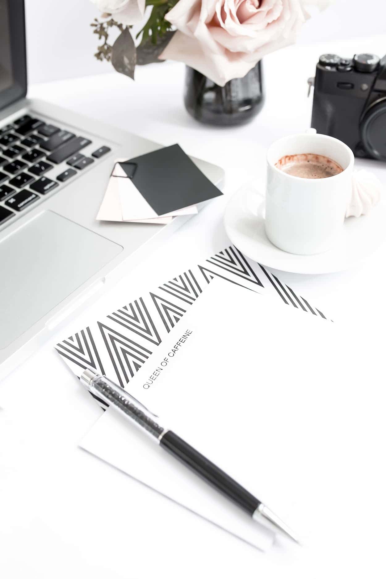A desk with a laptop, coffee, and creative essentials reflects the workspace behind our ideas and inspiration.