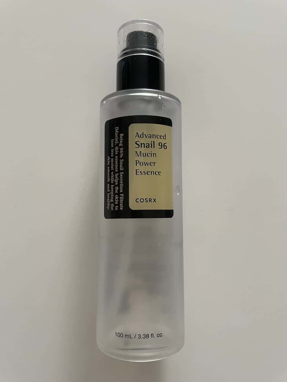 COSRX Snail Mucin 96% Repairing Serum on a white background.