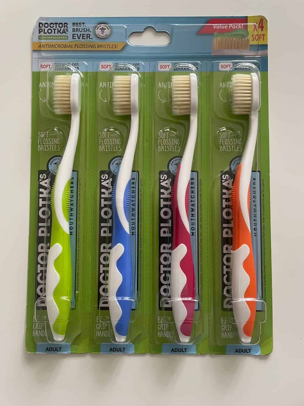 MOUTHWATCHERS Dr. Plotkas Soft Bristle Toothbrush on a white background.