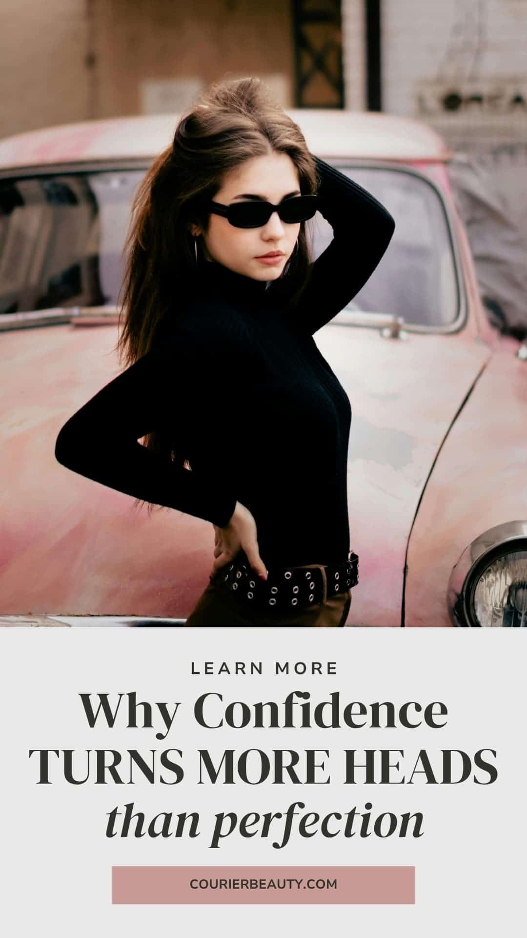 A woman wearing a turtleneck and sunglasses stands in front of a vintage car.